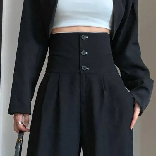 Pantalón negro de mujer de cintura alta con bolsillos